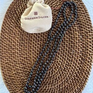 Black Fresh Water Pearl Necklace by Stephen Silver. 30” long.